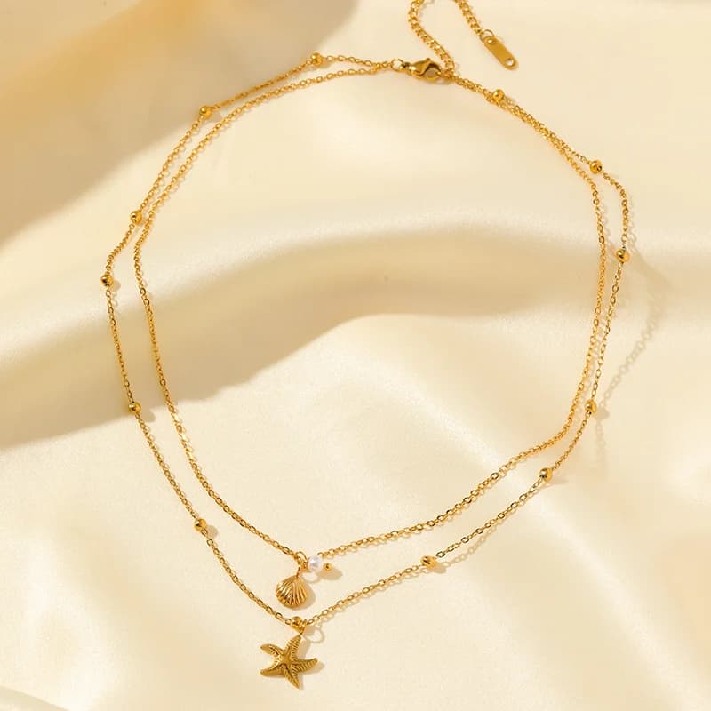 Doppelkettiges Anhänger-Halsband mit Seestern- und Muschel-Motiv, Gold