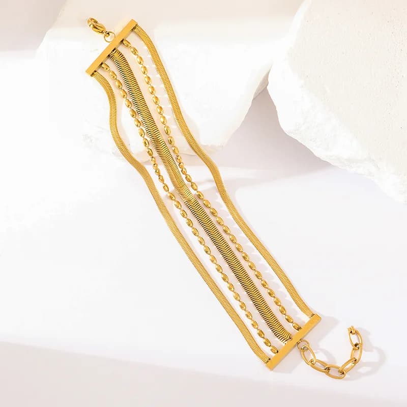 Breites mehrreihiges Edelstahl-Armband in Gold