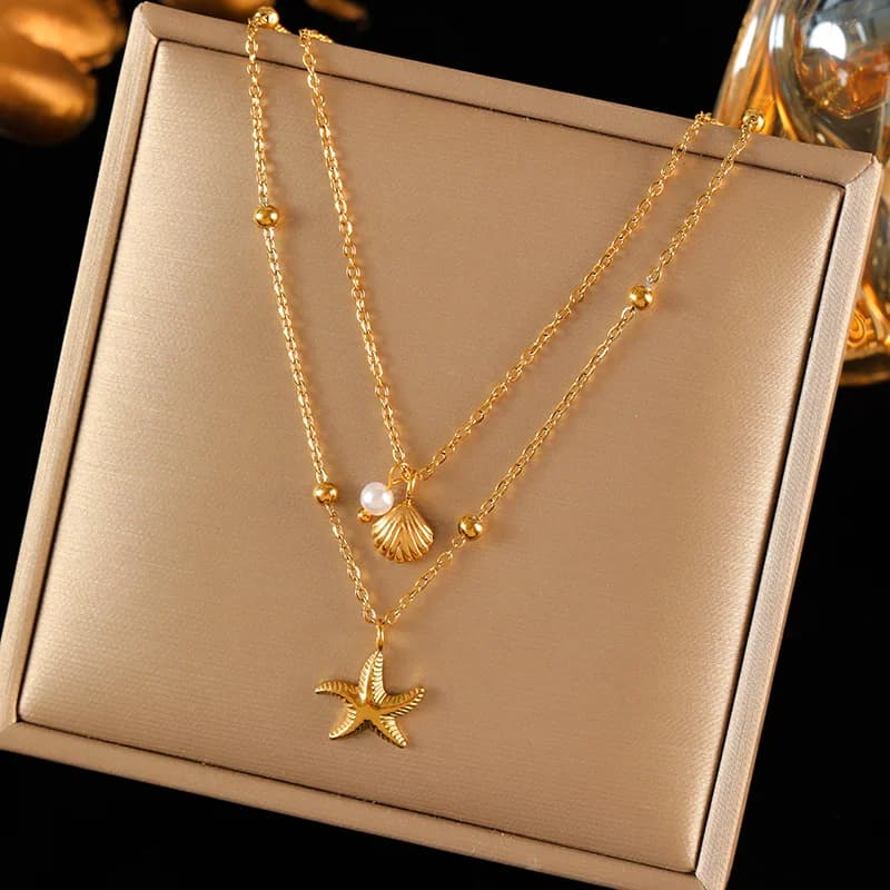 Doppelkettiges Anhänger-Halsband mit Seestern- und Muschel-Motiv, Gold